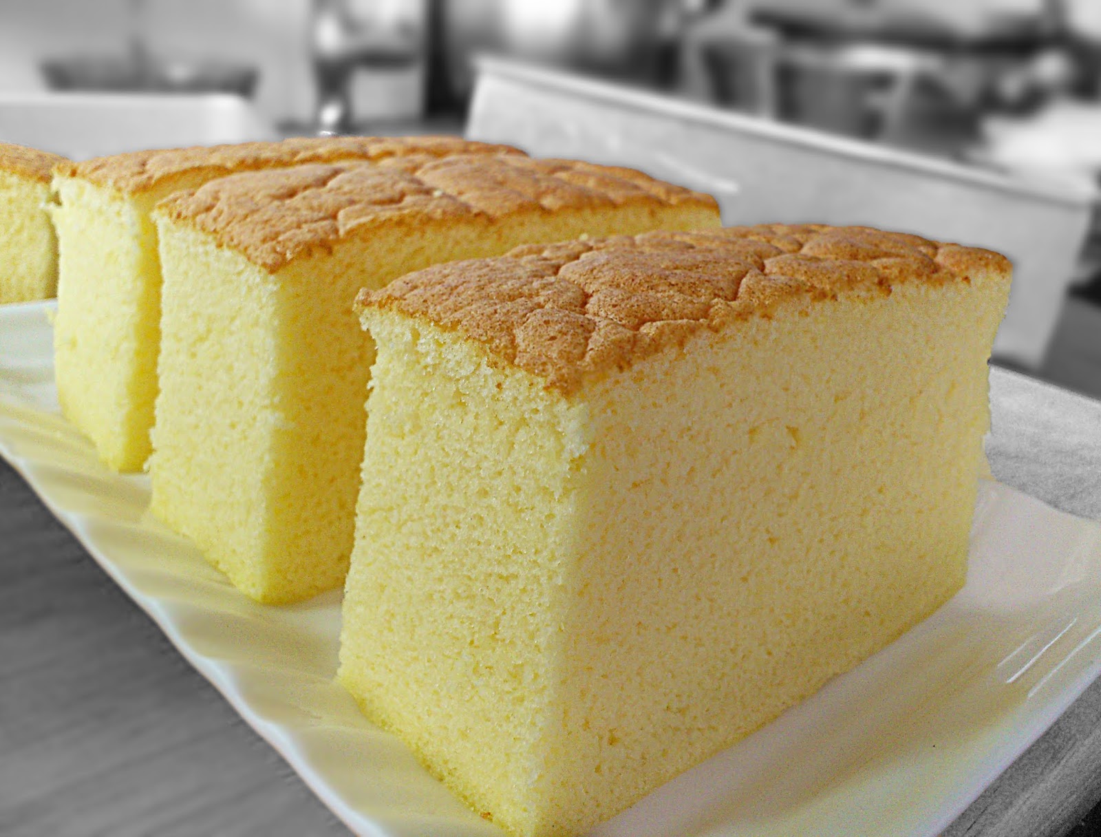 square ogura cake sitting on a cooling rack