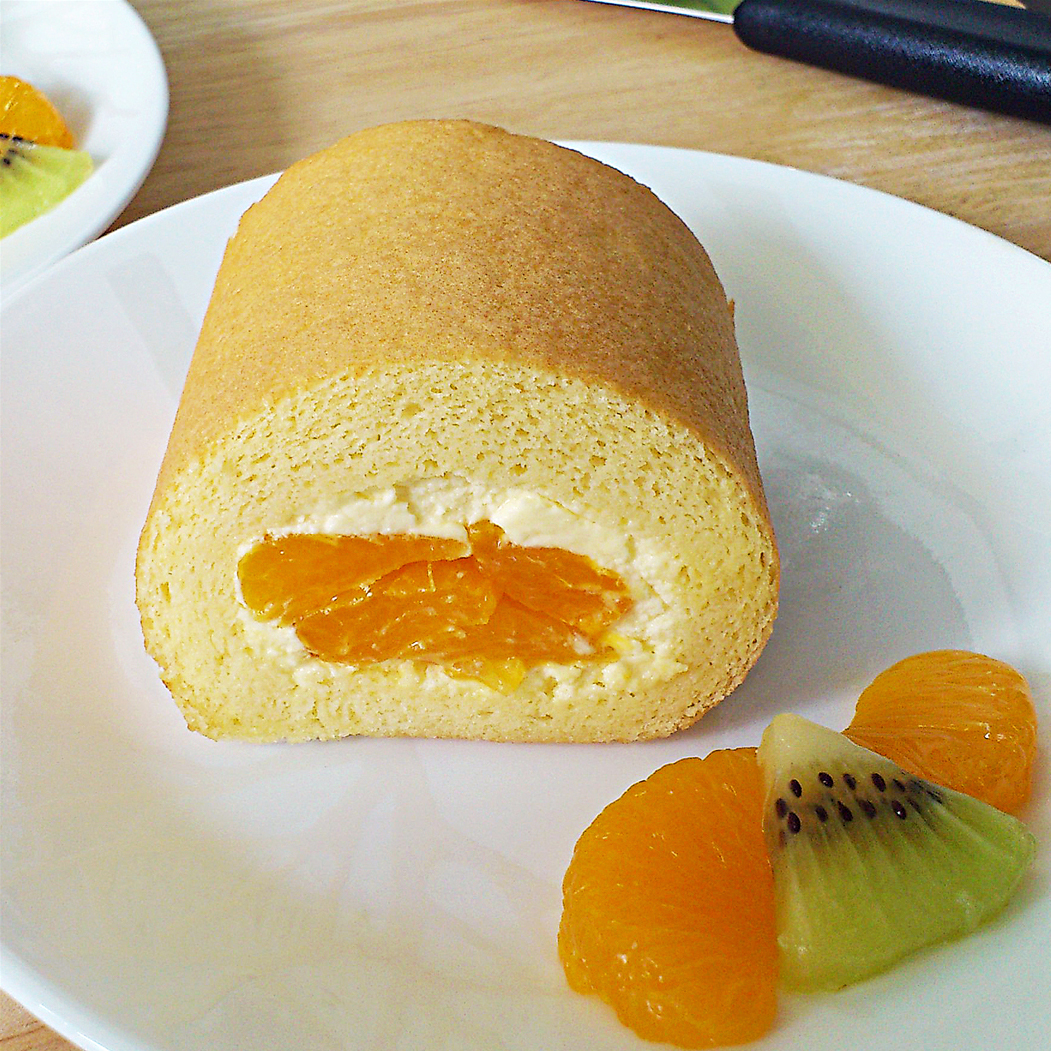 vanilla swiss roll with dairy cream and orange filling