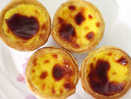 4 beautifully burnt portuguese egg tarts