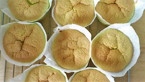 pandan chiffon cupcakes cooling down, tops no longer cracked