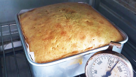 butter cake baking and puffed up in the oven